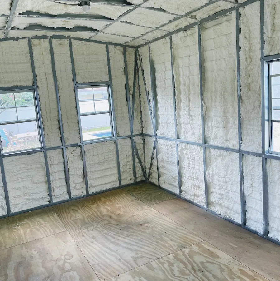 Closed-cell spray foam insulation applied to wall cavities in a residential project in Swissvale
